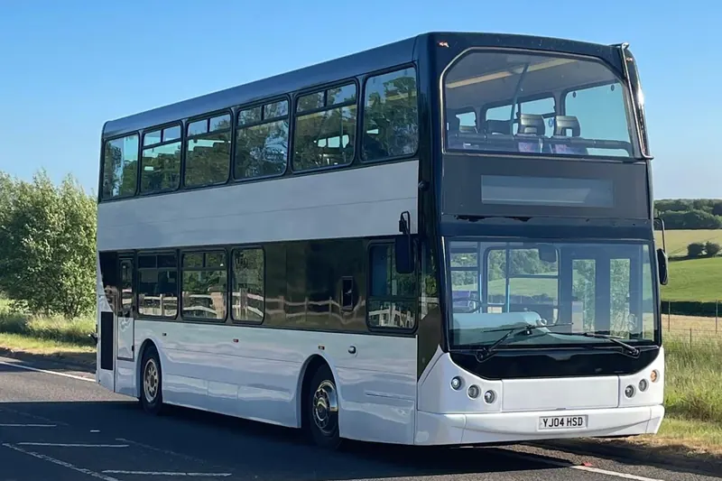 Leap Travel 80-seat belted double-decker bus on a country road